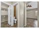 Bathroom featuring tile flooring, a water closet, and view to the Primary bedroom at 8406 Belmont Valley St, Las Vegas, NV 89123