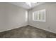This bedroom is empty, but it contains a ceiling fan and a shuttered window at 8406 Belmont Valley St, Las Vegas, NV 89123