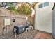 Image of the equipment used to maintain the backyard pool, all neatly organized on gravel at 8406 Belmont Valley St, Las Vegas, NV 89123