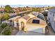 Aerial of the single story home featuring desert landscaping, front yard, solar panels and a two car garage at 8406 Belmont Valley St, Las Vegas, NV 89123