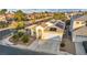 Aerial view of single-story home featuring desert landscaping, front yard, solar panels, and a two-car garage at 8406 Belmont Valley St, Las Vegas, NV 89123