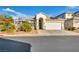 Charming single-story home with desert landscaping, two-car garage, and solar panels at 8406 Belmont Valley St, Las Vegas, NV 89123