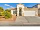 Charming single-story home with well-manicured landscaping and attached two-car garage at 8406 Belmont Valley St, Las Vegas, NV 89123