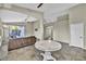 Open living room with tile floors, neutral walls, and access to backyard at 8406 Belmont Valley St, Las Vegas, NV 89123