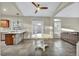 Open layout living room featuring tile flooring and seamless access to the kitchen at 8406 Belmont Valley St, Las Vegas, NV 89123