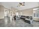 Spacious living room featuring tile floors, a ceiling fan, and an open layout perfect for entertaining at 8406 Belmont Valley St, Las Vegas, NV 89123