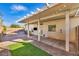 This covered patio offers the perfect outdoor space with pool view and a mounted TV at 8406 Belmont Valley St, Las Vegas, NV 89123