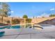 Backyard pool with elevated hot tub, all set within a private walled yard at 8406 Belmont Valley St, Las Vegas, NV 89123