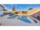 Sparkling pool and spa enhance this backyard, offering a delightful escape for homeowners at 8406 Belmont Valley St, Las Vegas, NV 89123