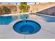 Sparkling pool with attached spa offers a serene retreat for relaxation and recreation at 8406 Belmont Valley St, Las Vegas, NV 89123
