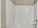 The shower features tiled walls and a convenient built-in shelf at 8406 Belmont Valley St, Las Vegas, NV 89123