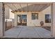 Shaded patio area with sliding door and view of the backyard and perimeter fence at 8732 Majestic Pine Ave, Las Vegas, NV 89143