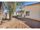 Landscaped backyard with a covered patio and privacy fence at 8732 Majestic Pine Ave, Las Vegas, NV 89143