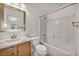 Bathroom featuring vanity, toilet, and combined shower and tub at 8732 Majestic Pine Ave, Las Vegas, NV 89143