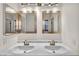 Bathroom featuring double sinks, a large mirror, and modern fixtures at 8732 Majestic Pine Ave, Las Vegas, NV 89143