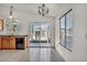 Bright dining area featuring tile flooring, wood cabinets, and sliding glass doors at 8732 Majestic Pine Ave, Las Vegas, NV 89143