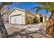 Inviting single-story home featuring desert landscaping, attached garage and neutral color palette at 8732 Majestic Pine Ave, Las Vegas, NV 89143