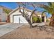Charming single-story home with a well-maintained front yard and two-car garage at 8732 Majestic Pine Ave, Las Vegas, NV 89143