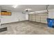 Spacious two car garage with storage cabinets and automatic door at 8732 Majestic Pine Ave, Las Vegas, NV 89143