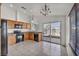 Functional kitchen with black appliances, wood cabinets, and a bright breakfast nook at 8732 Majestic Pine Ave, Las Vegas, NV 89143