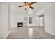 Bright living room featuring tile flooring, fireplace, and neutral walls at 8732 Majestic Pine Ave, Las Vegas, NV 89143