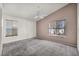 Spacious main bedroom featuring two windows and neutral-colored carpet at 8732 Majestic Pine Ave, Las Vegas, NV 89143