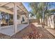 Outdoor patio area with pergola cover and desert landscaping at 8732 Majestic Pine Ave, Las Vegas, NV 89143