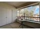 Relaxing balcony offering serene views of the pool and lush greenery, perfect for morning coffee or evening relaxation at 908 Domnus Ln # 203, Las Vegas, NV 89144