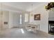 Charming dining area with a chandelier, table with four chairs, and a view of the front door at 908 Domnus Ln # 203, Las Vegas, NV 89144