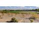 Expansive golf course view highlighting lush green grass, sand traps, with residential area in the background at 908 Domnus Ln # 203, Las Vegas, NV 89144