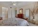 Comfortable bedroom with ensuite bath, dresser, and a door to a private balcony at 908 Domnus Ln # 203, Las Vegas, NV 89144