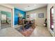 Bright dining area featuring a wooden table, seating for four, and an accent wall at 91 Hawk Ave, Pahrump, NV 89060