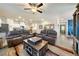 Open-concept living room flows into the kitchen, offering tile flooring and ample seating at 91 Hawk Ave, Pahrump, NV 89060