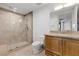 Modern bathroom featuring a glass-enclosed shower, vanity with marble countertop, and updated fixtures at 9101 Alta Dr # 205, Las Vegas, NV 89145