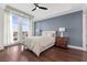 Bright bedroom boasting hardwood floors, a large window with views, and a contemporary ceiling fan at 9101 Alta Dr # 205, Las Vegas, NV 89145