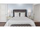 Well-lit bedroom featuring nightstands with lamps, a stylish headboard, and neutral-colored decor at 9101 Alta Dr # 205, Las Vegas, NV 89145