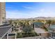 Lush community with mature trees, featuring manicured landscaping and elegant architecture under a bright blue sky at 9101 Alta Dr # 205, Las Vegas, NV 89145