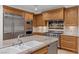 Gourmet kitchen showcasing stainless steel appliances and a center island with granite counters at 9101 Alta Dr # 205, Las Vegas, NV 89145