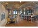 Lounge area featuring a bar with seating, a fireplace, and an outside patio at 9101 Alta Dr # 205, Las Vegas, NV 89145