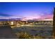 Scenic night view showcasing the vibrant city skyline and twinkling lights against a colorful sky at 9101 Alta Dr # 205, Las Vegas, NV 89145