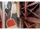 Unique wine cellar with custom wood shelving, wine refrigerator, and a stylish vintage mural at 9101 Alta Dr # 205, Las Vegas, NV 89145