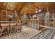 Sophisticated wine cellar with custom wooden cabinets and a central tasting bar at 9101 Alta Dr # 205, Las Vegas, NV 89145