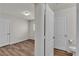 Bedroom with wood-look flooring, complemented by an attached bathroom at 9526 Vast Valley Ave, Las Vegas, NV 89148