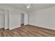 Comfortable bedroom with wood-look flooring, neutral walls, and a spacious closet at 9526 Vast Valley Ave, Las Vegas, NV 89148