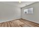 Comfortable bedroom featuring wood-look flooring and a window providing natural light at 9526 Vast Valley Ave, Las Vegas, NV 89148