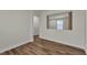 Spacious room showcasing modern wood-look floors and neutral wall colors at 9526 Vast Valley Ave, Las Vegas, NV 89148