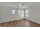 Bedroom with wood-look flooring, neutral walls, and multiple windows providing great natural light at 9526 Vast Valley Ave, Las Vegas, NV 89148