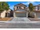 Attractive two-story home with a two-car garage, tile roof, and well-maintained landscaping at 9526 Vast Valley Ave, Las Vegas, NV 89148