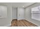 Bright foyer with wood-look flooring, a closet, and a white front door at 9526 Vast Valley Ave, Las Vegas, NV 89148