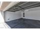 Spacious, clean garage interior with overhead door, white walls and ceiling, and a sealed concrete floor at 9526 Vast Valley Ave, Las Vegas, NV 89148